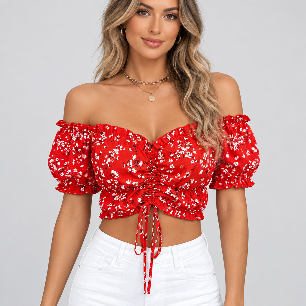 Red floral off-shoulder top worn by a person with a blurred background